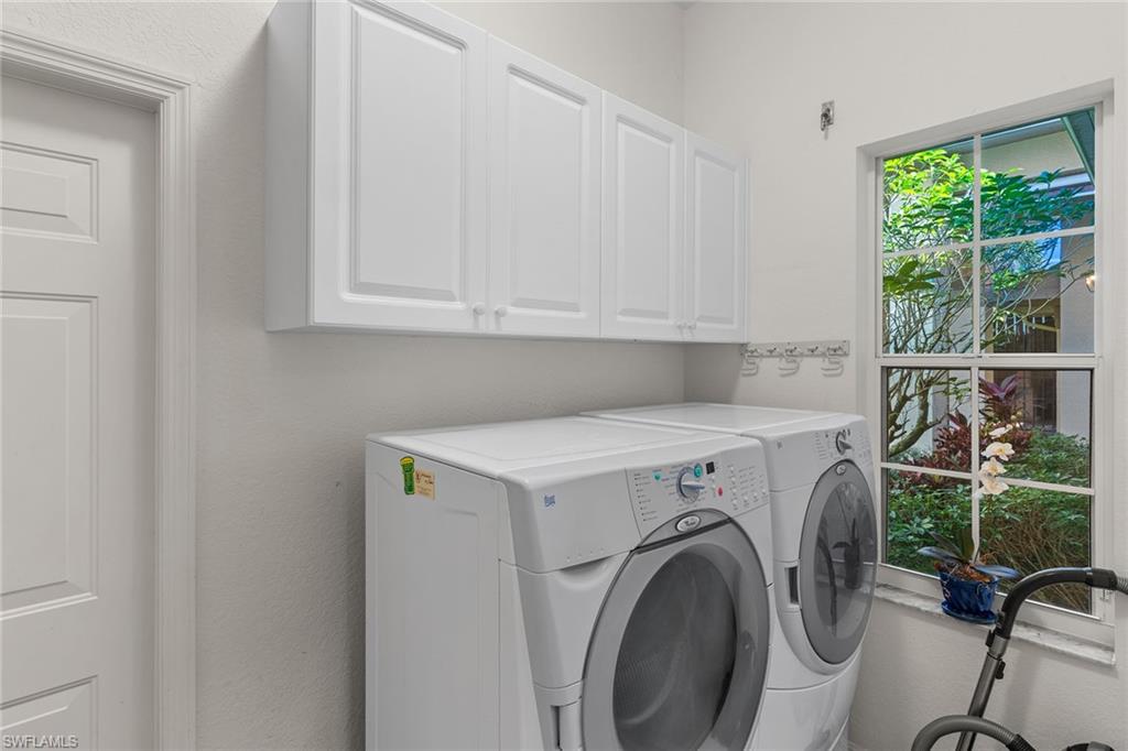8840 Mariposa Court Naples, FL 34113 - Photo 48 of 50 a utility room with dryer and washer