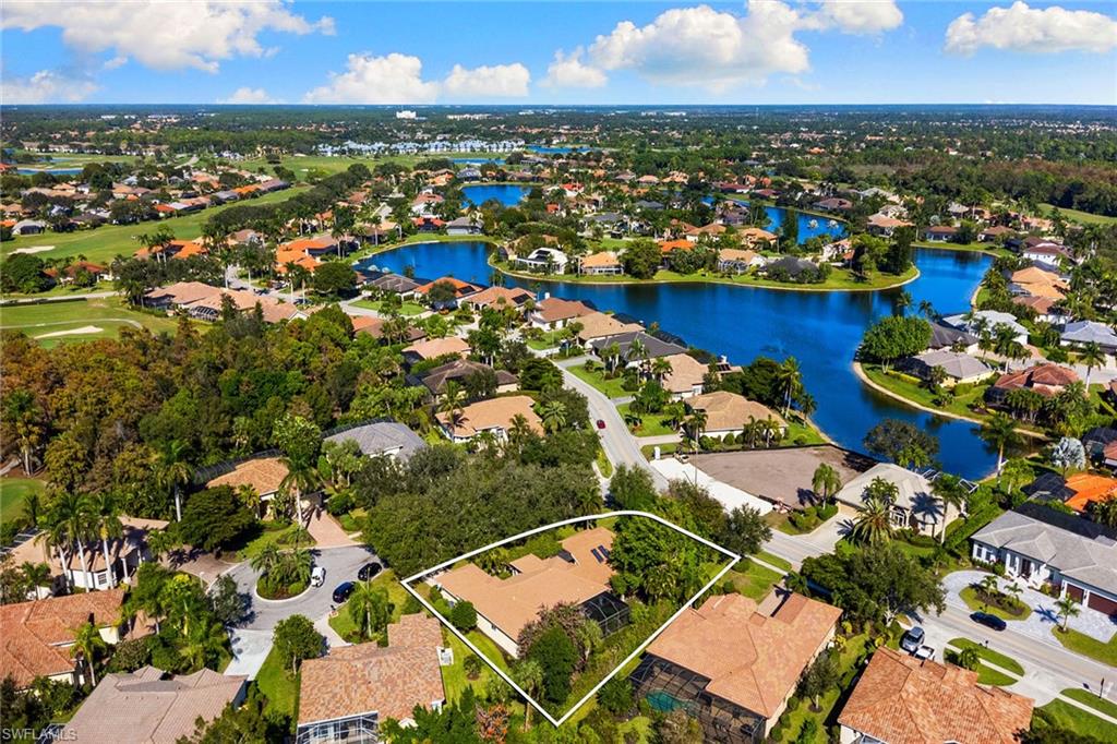 8840 Mariposa Court Naples, FL 34113 - Photo 50 of 50 an aerial view of residential houses with outdoor space