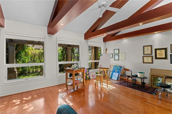 a view of a livingroom with furniture and windows