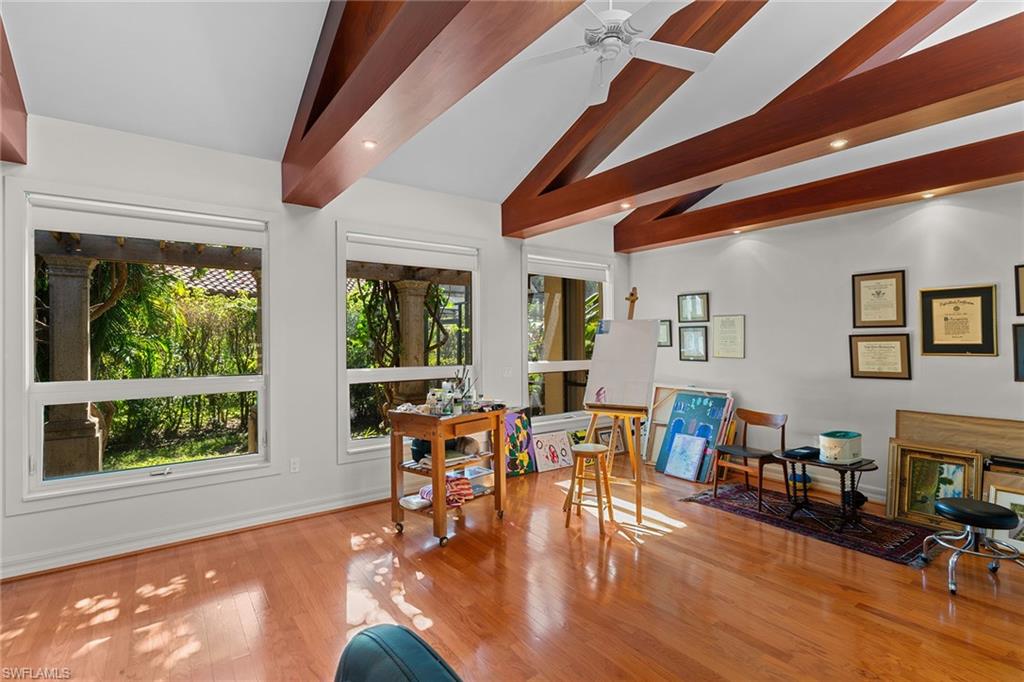 8840 Mariposa Court Naples, FL 34113 - Photo 5 of 50 a living room with furniture and wooden floor