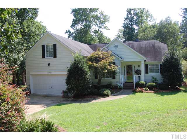 10713 Durant Road Raleigh, NC 27615 - Photo 1 of 12 a view of a house with a yard and sitting area