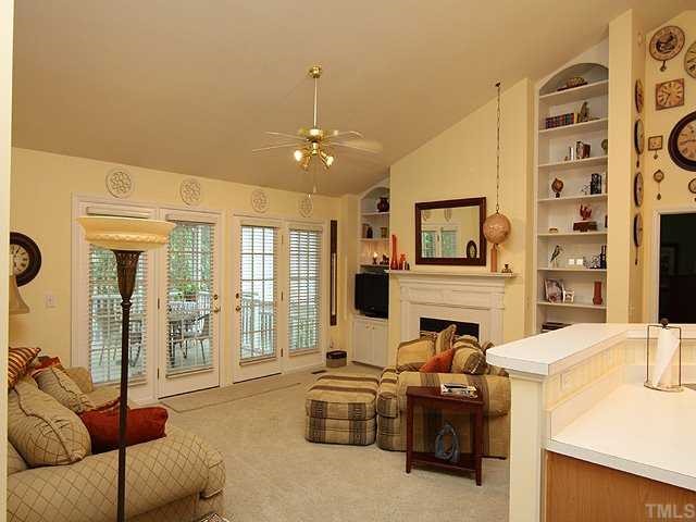 10713 Durant Road Raleigh, NC 27615 - Photo 2 of 12 a living room with furniture and a flat screen tv
