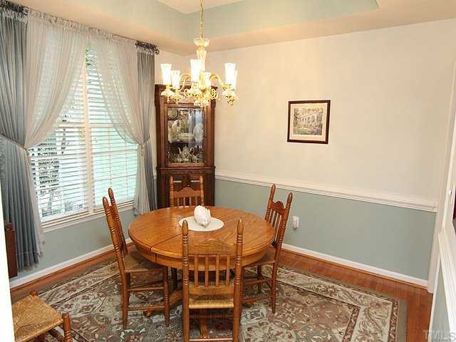 10713 Durant Road Raleigh, NC 27615 - Photo 3 of 12 a view of a dining room with furniture and window