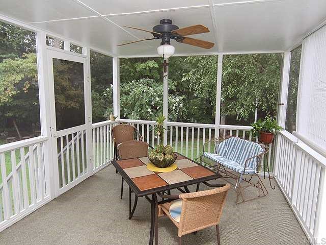 10713 Durant Road Raleigh, NC 27615 - Photo 10 of 12 a view of a chairs and table in the patio