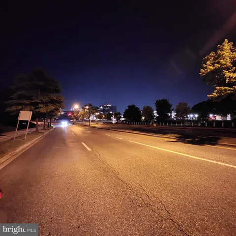 a view of street with lots of green space