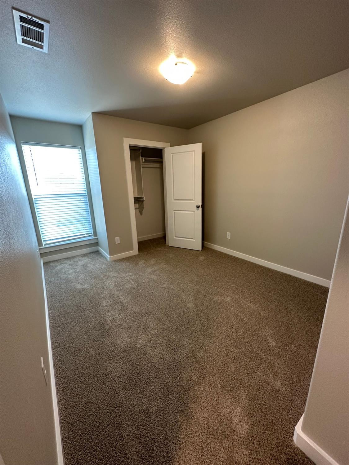 1604 135th Street Lubbock, TX 79423 - Photo 12 of 15 an empty room with closet area