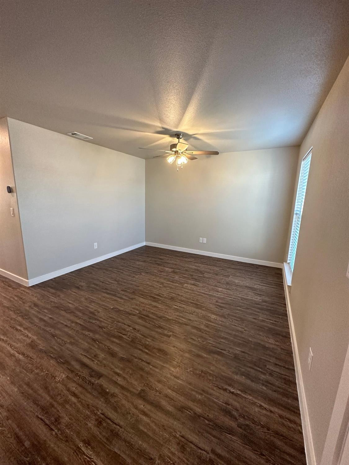 1604 135th Street Lubbock, TX 79423 - Photo 2 of 15 wooden floor in an empty room