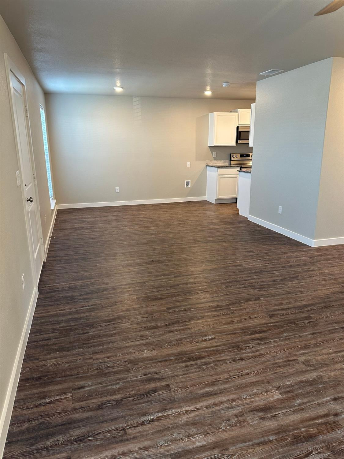 1604 135th Street Lubbock, TX 79423 - Photo 3 of 15 a view of a room with wooden floor