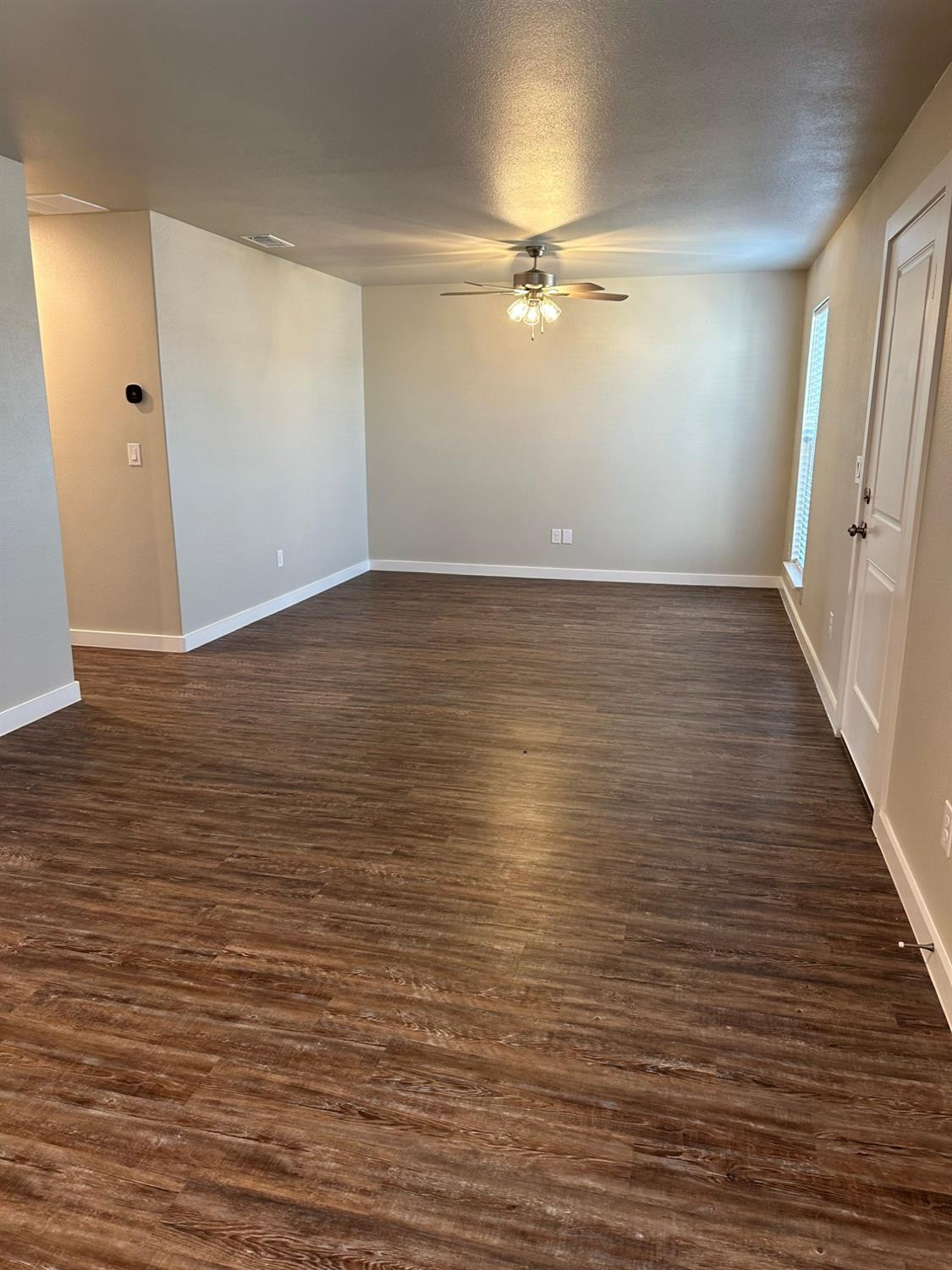 1604 135th Street Lubbock, TX 79423 - Photo 4 of 15 wooden floor in an empty room