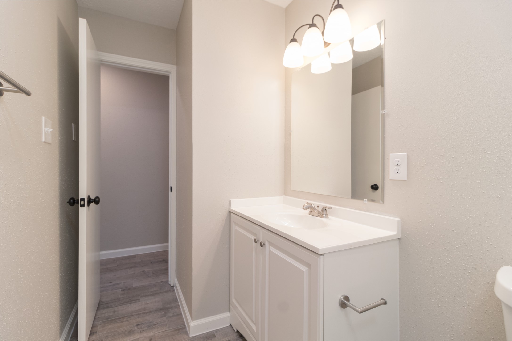 9603 Seeker Street Houston, TX 77078 - Photo 11 of 21 a bathroom with a sink vanity and mirror