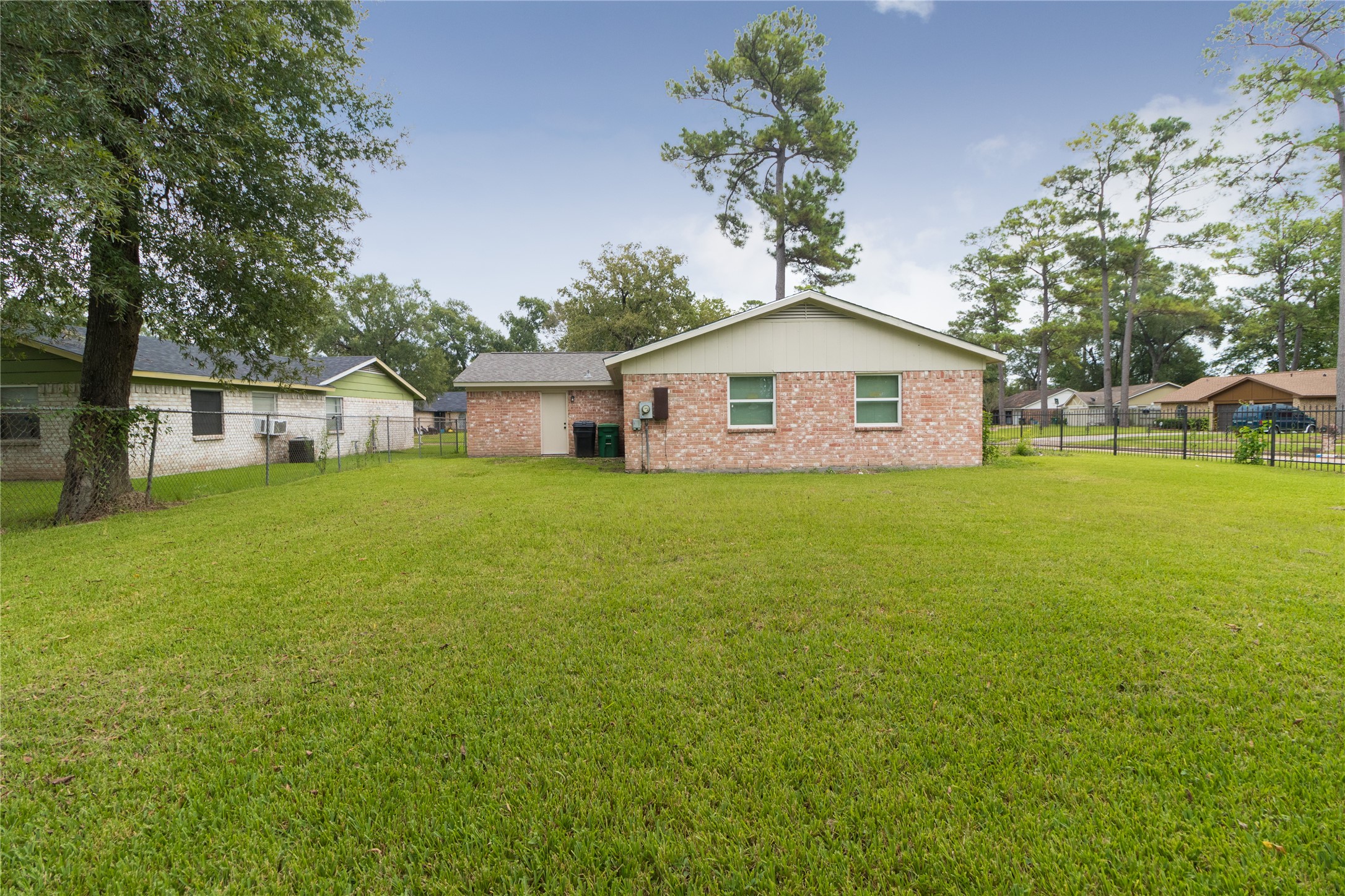 9603 Seeker Street Houston, TX 77078 - Photo 21 of 21 a view of a house with a yard