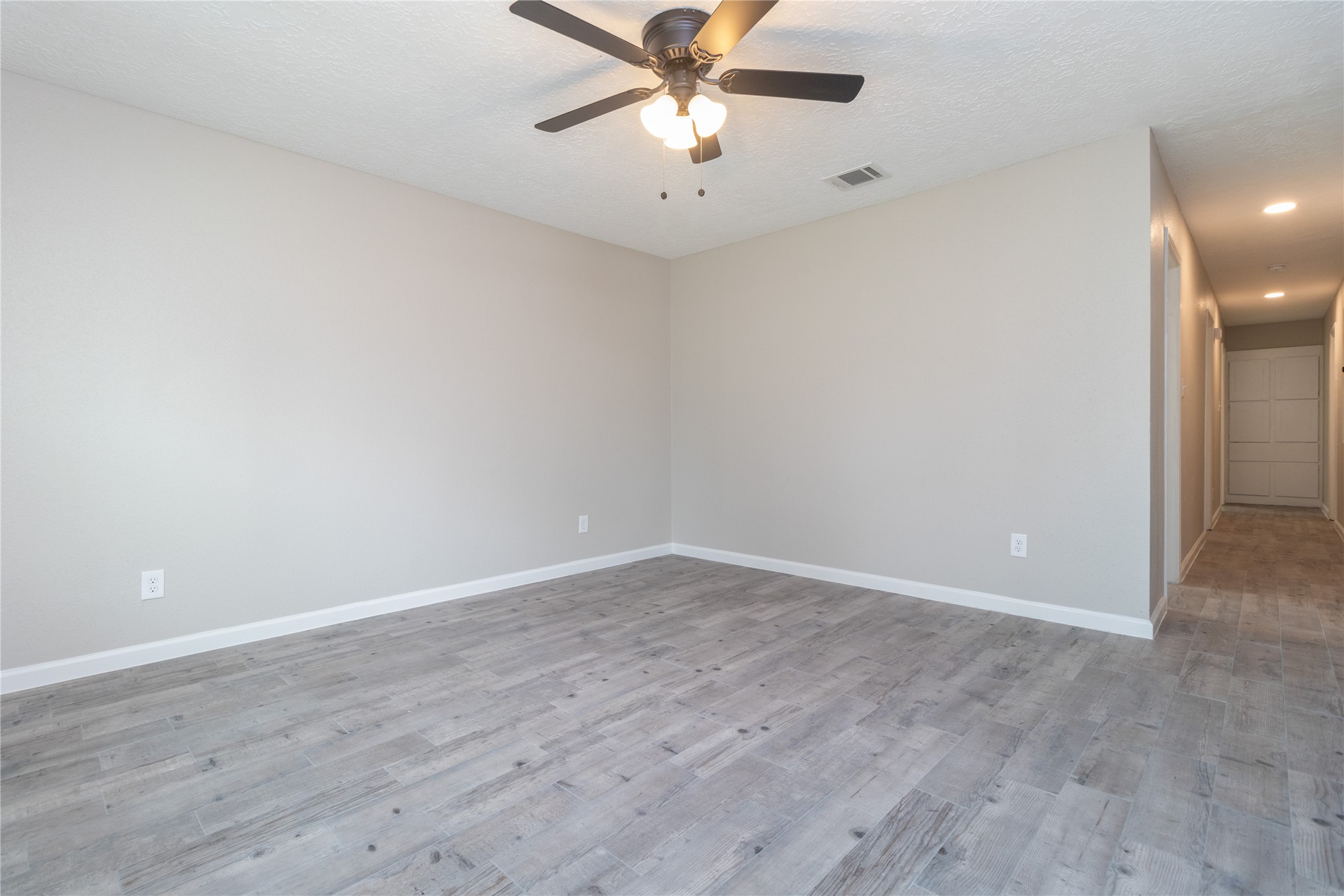 9603 Seeker Street Houston, TX 77078 - Photo 6 of 21 wooden floor in an empty room