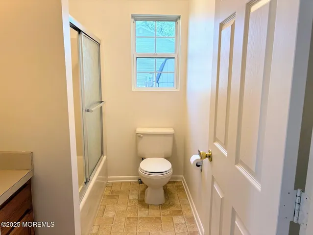 a bathroom with a toilet and a sink