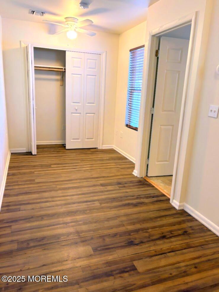548 Clark Avenue, Unit B Union Beach, NJ 07735 - Photo 6 of 7 a view of an empty room with wooden floor