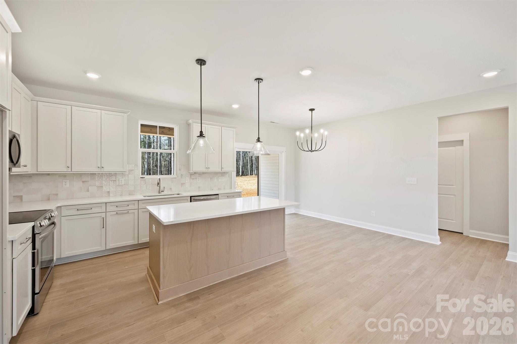 2279 Lee Lawing Road Lincolnton, NC 28092 - Photo 13 of 41 a kitchen with a sink cabinets and window