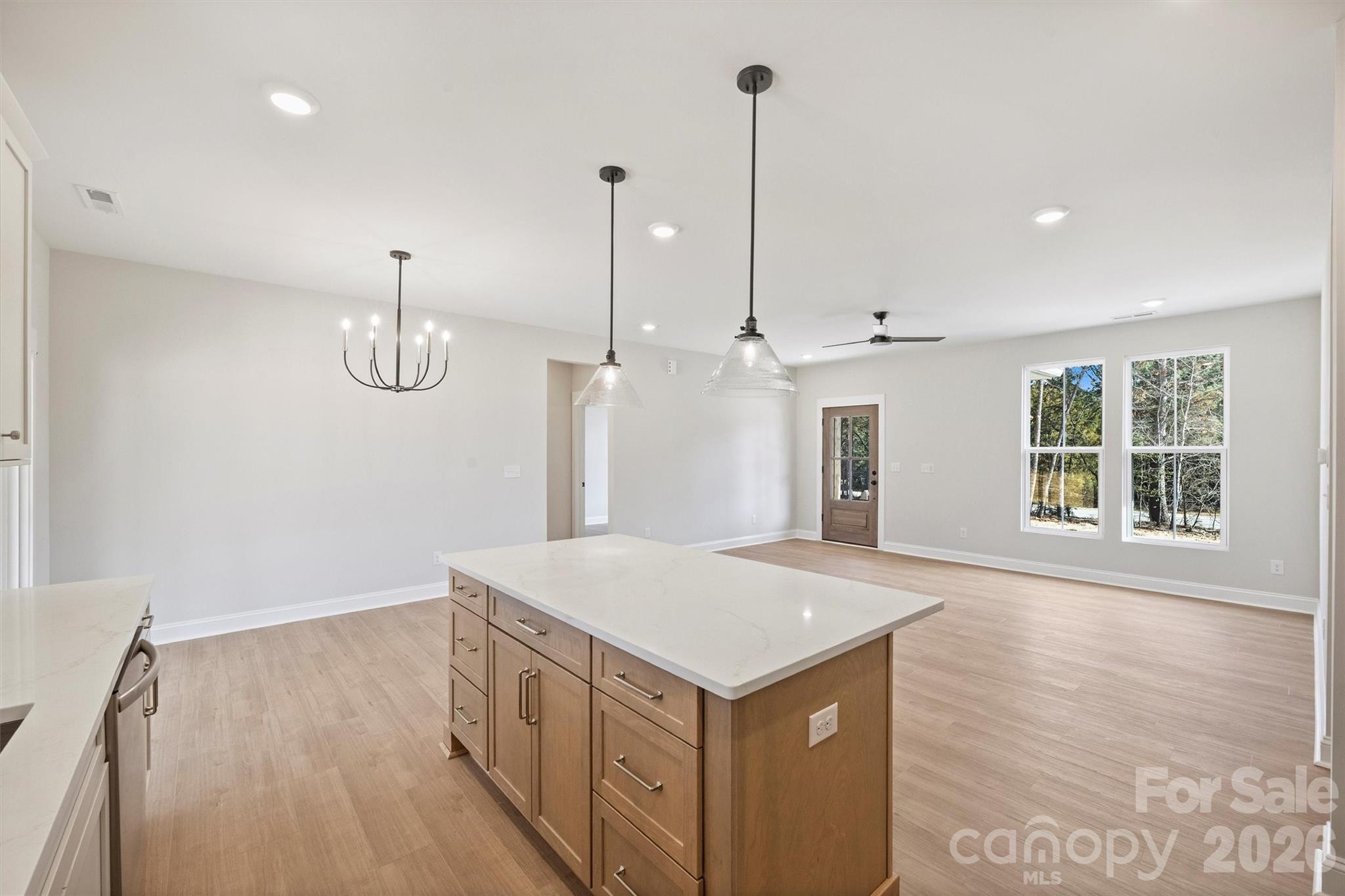 2279 Lee Lawing Road Lincolnton, NC 28092 - Photo 16 of 41 a view of an empty room with wooden floor and windows