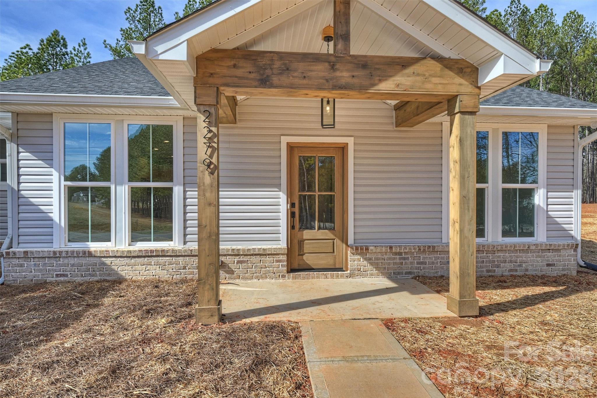 2279 Lee Lawing Road Lincolnton, NC 28092 - Photo 2 of 41 a front view of a house with a garden