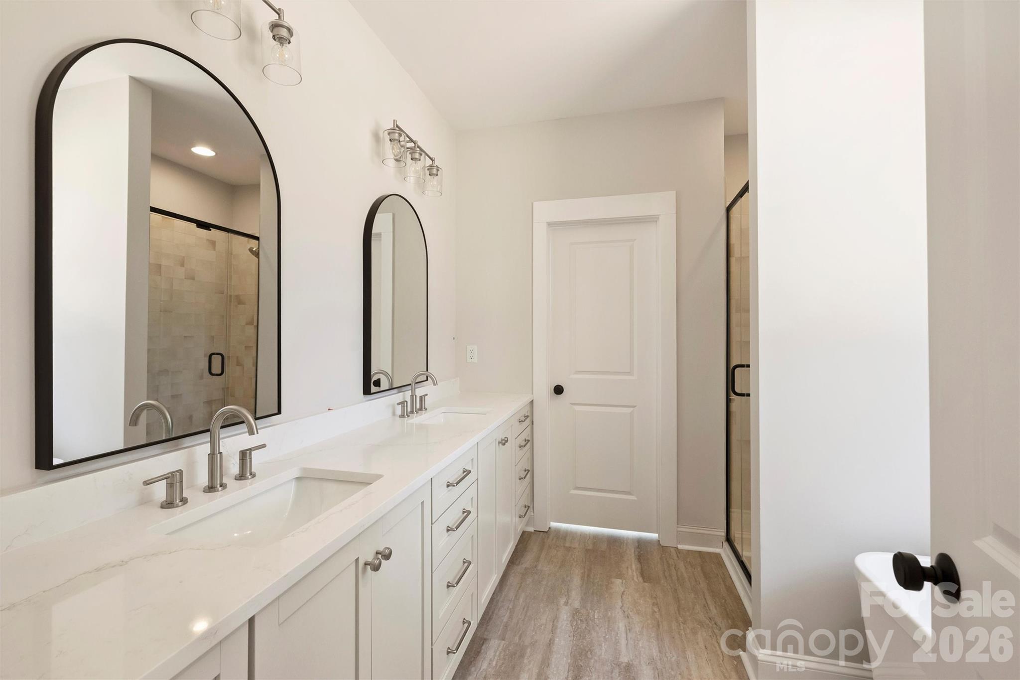 2279 Lee Lawing Road Lincolnton, NC 28092 - Photo 21 of 41 a spacious bathroom with a double vanity sink and a mirror