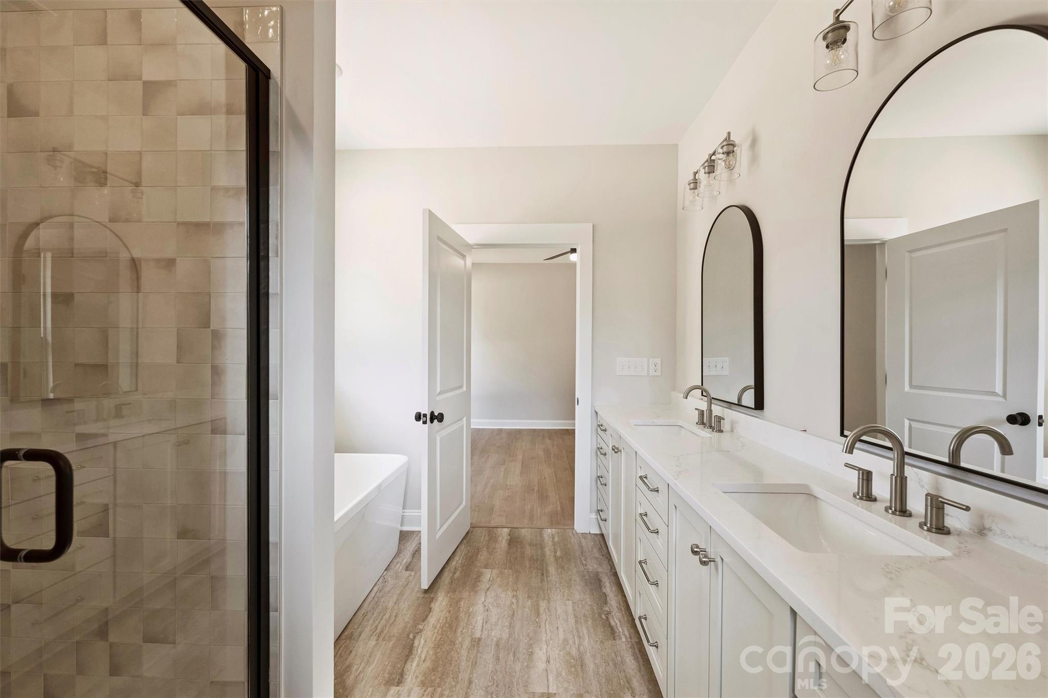 2279 Lee Lawing Road Lincolnton, NC 28092 - Photo 23 of 41 a spacious bathroom with a double vanity sink a mirror and a shower