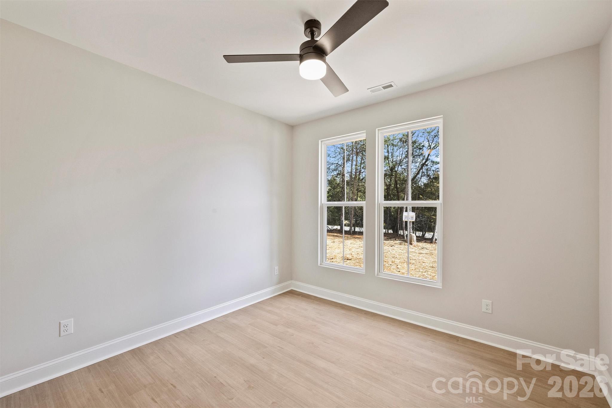 2279 Lee Lawing Road Lincolnton, NC 28092 - Photo 28 of 41 an empty room with windows and entrance
