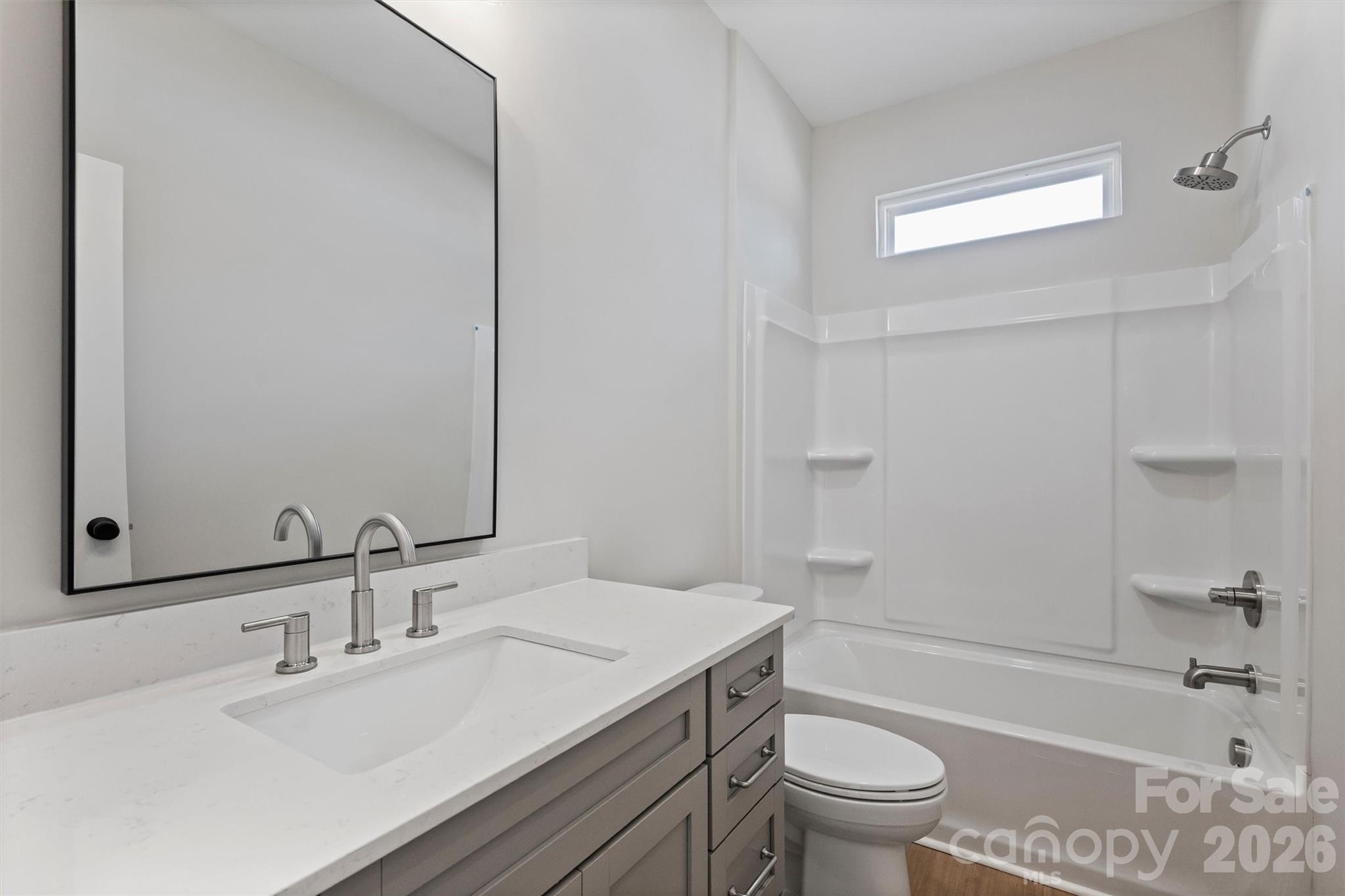 2279 Lee Lawing Road Lincolnton, NC 28092 - Photo 30 of 41 a bathroom with a sink a toilet and shower