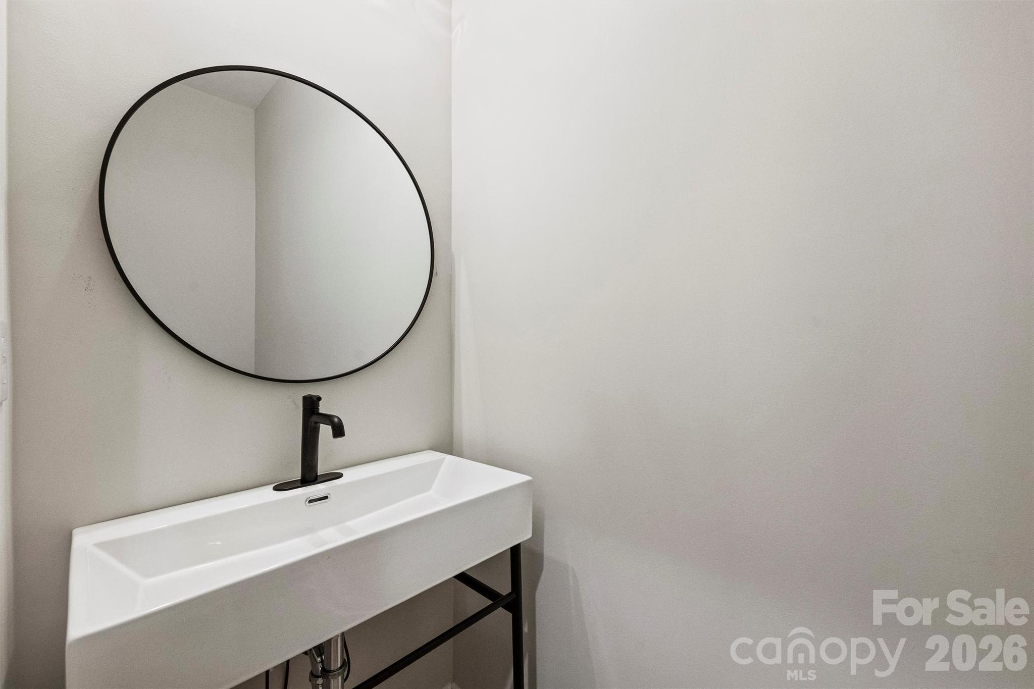 2279 Lee Lawing Road Lincolnton, NC 28092 - Photo 34 of 41 a bathroom with a sink and a mirror