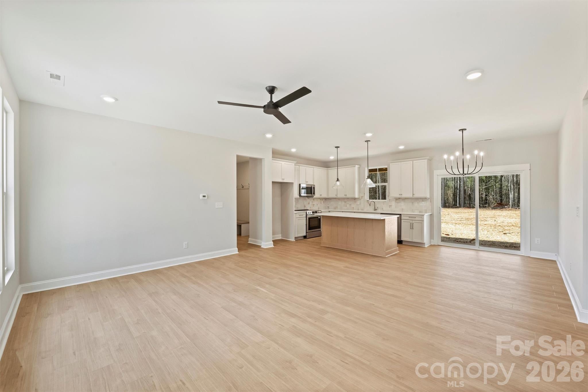 2279 Lee Lawing Road Lincolnton, NC 28092 - Photo 5 of 41 a view of a kitchen with wooden floor and windows
