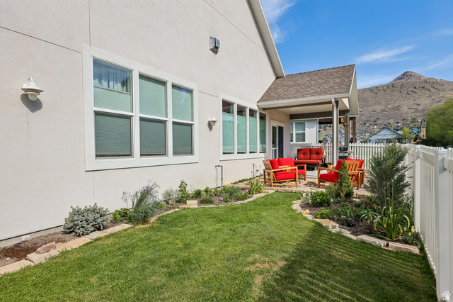 1238 Canyon View Road Midway, UT 84049 - Photo 30 of 36 Patio area featuring a covered porch, white picket fence, and a manicured lawn