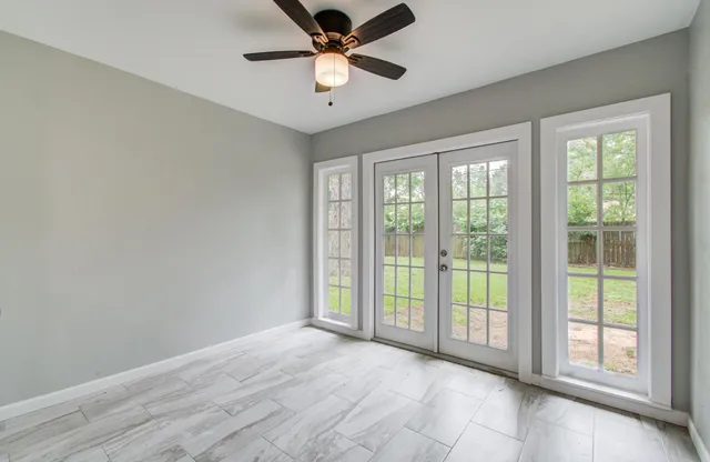 a view of an empty room with a window