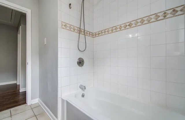 a bathroom with a shower and a bathtub