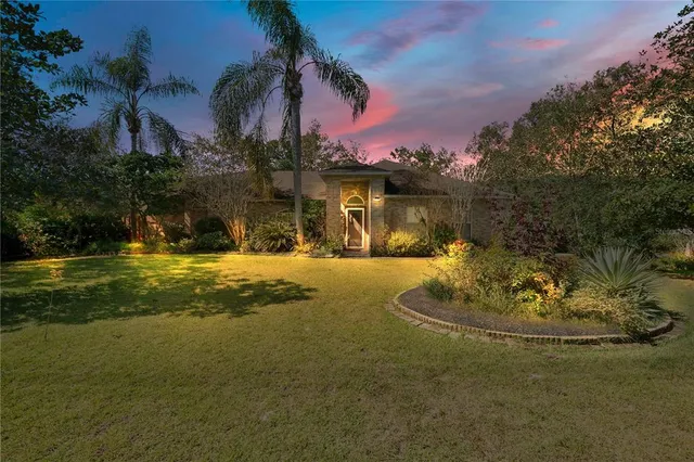 a swimming pool with outdoor seating and yard
