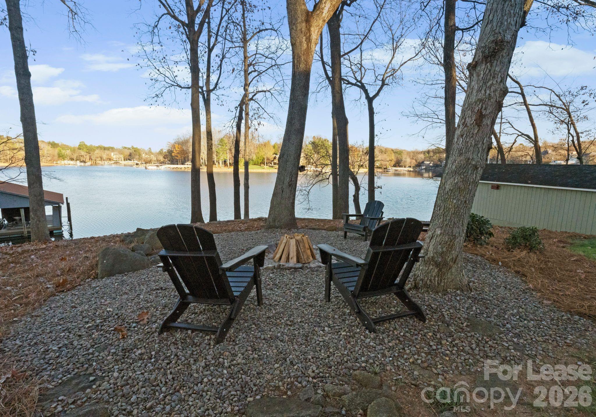 19709 Stough Farm Road Cornelius, NC 28031 - Photo 36 of 48 a backyard of a house with table and chairs