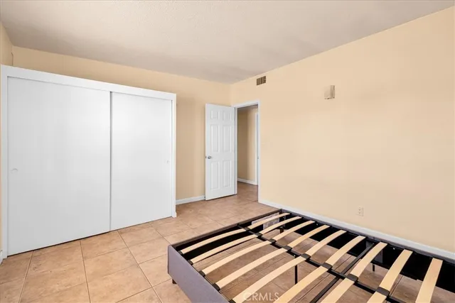 a view of a room with wooden floor and white walls