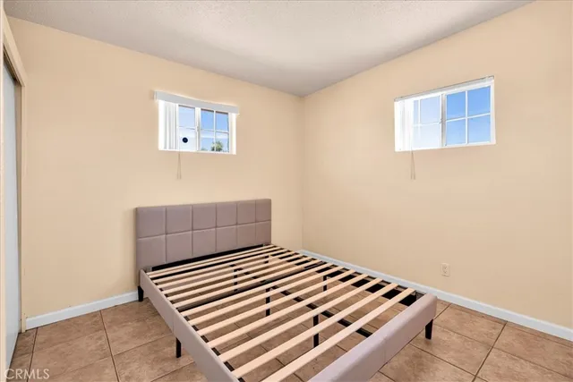 a view of room with stairs and a potted plant