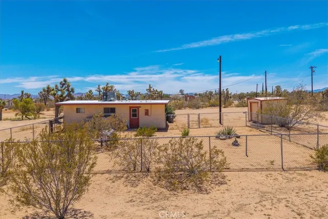 a view of a terrace with wooden fence