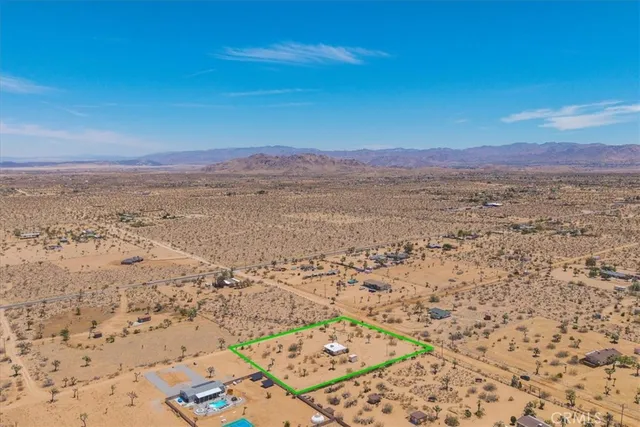 a view of an ocean beach and mountain