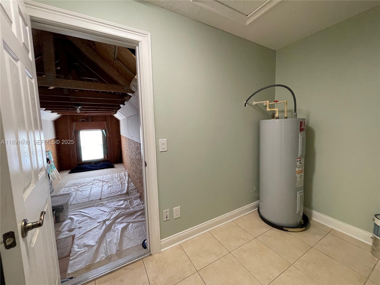 6841 Dolce Way Orlando, FL 32819 - Photo 35 of 38 utility room/ walk-in storage