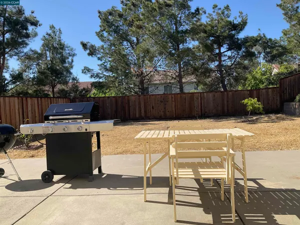 a view of a chairs and table in the patio