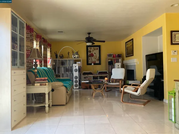 a living room with furniture and a clock