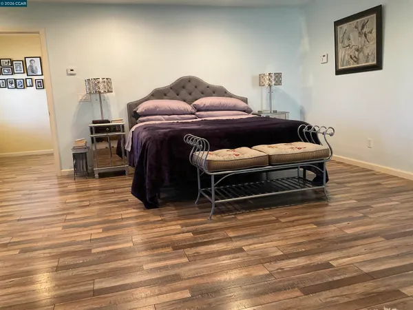 a bedroom with a bed and a view of bathroom