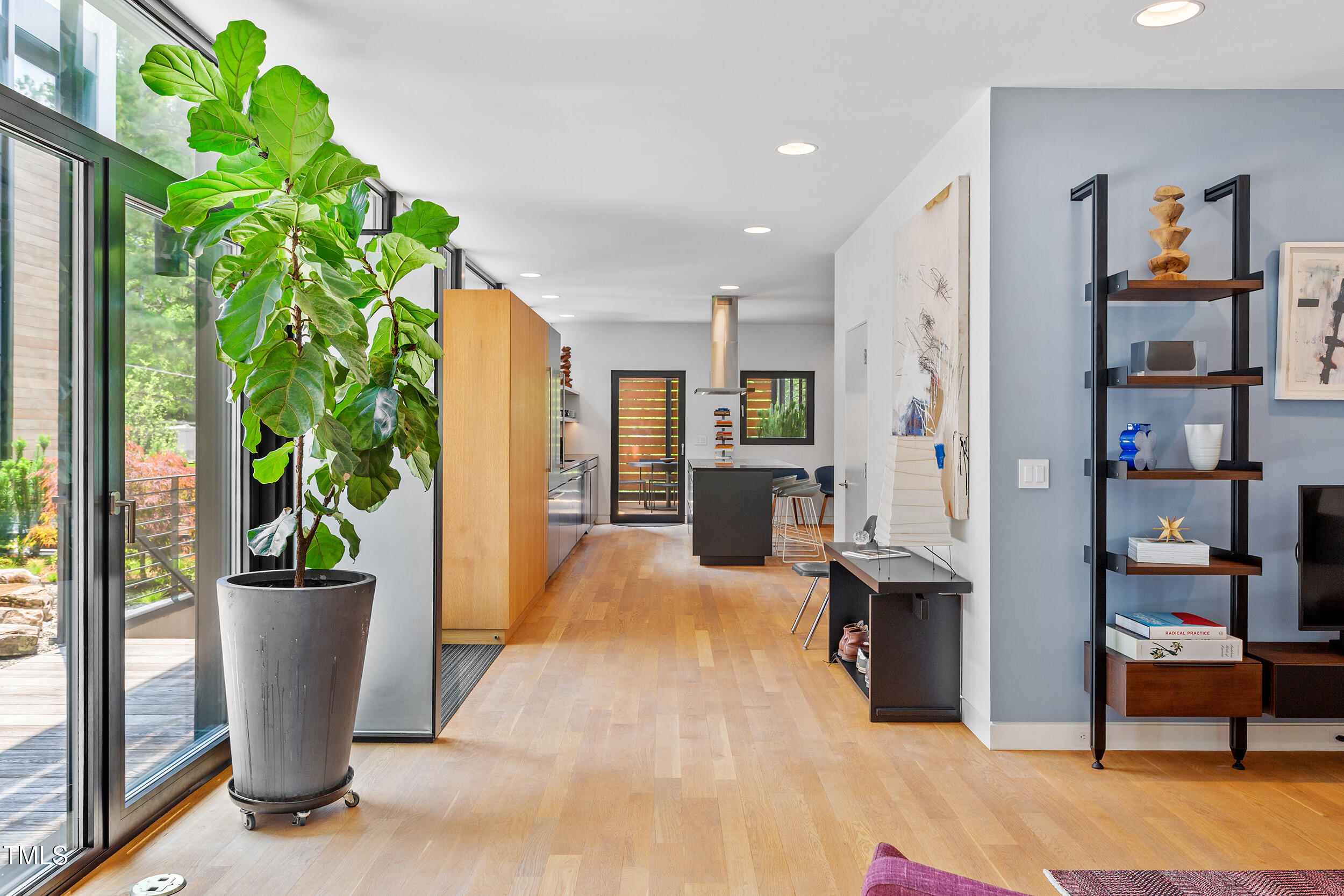 922 Tower Street Raleigh, NC 27607 - Photo 13 of 48 a view of living room filled with furniture and a potted plant