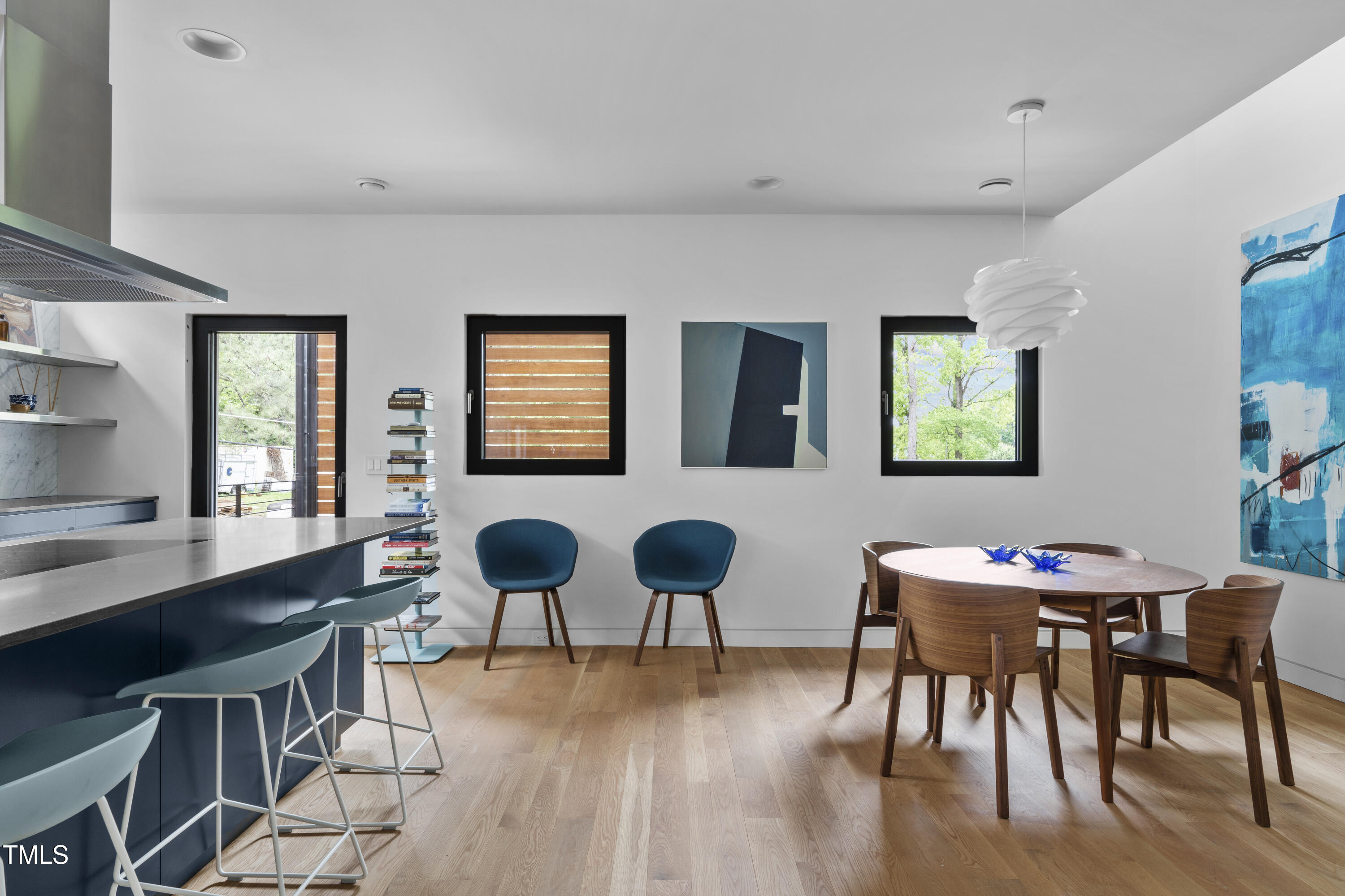 922 Tower Street Raleigh, NC 27607 - Photo 18 of 48 a dining room with furniture and wooden floor