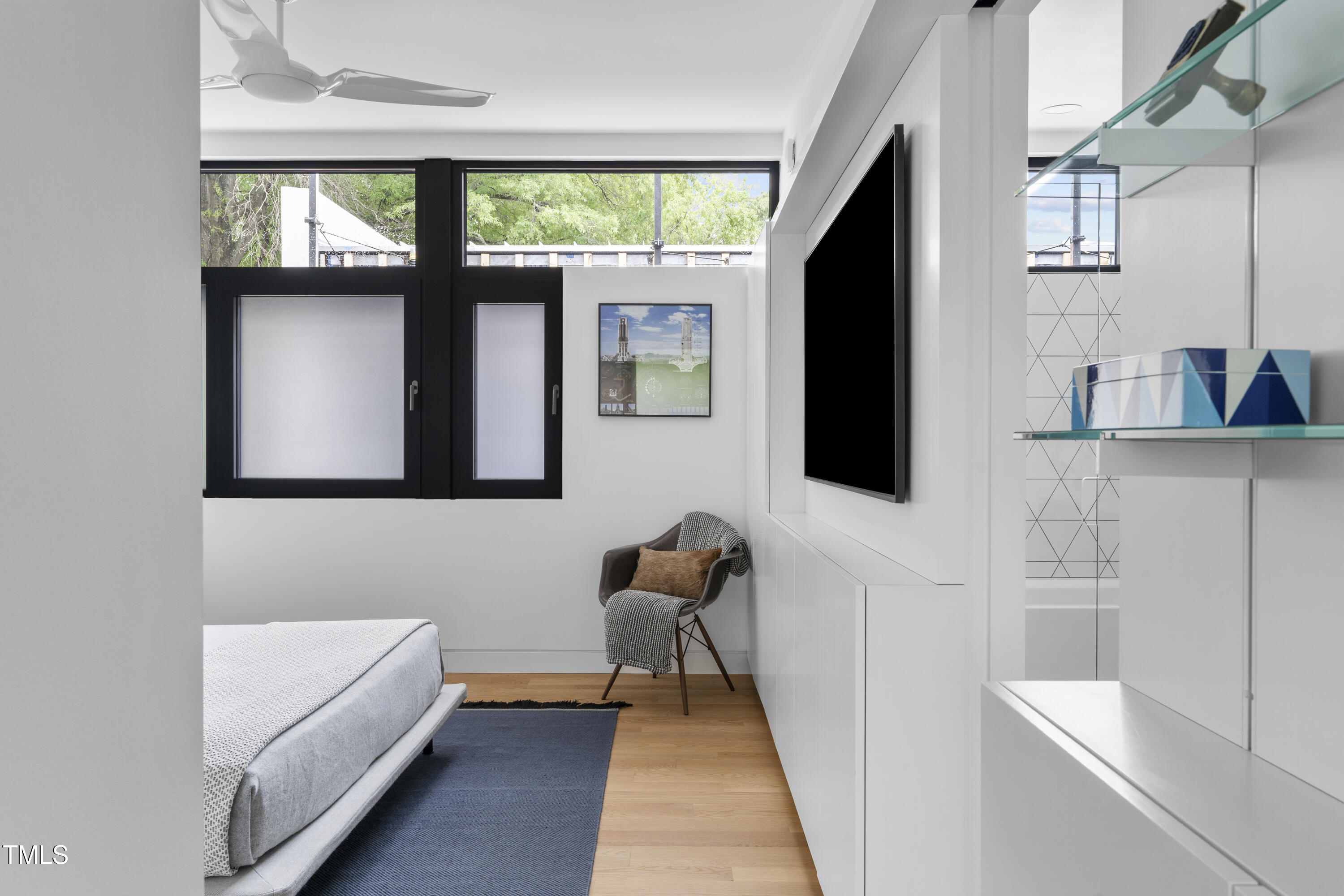 922 Tower Street Raleigh, NC 27607 - Photo 26 of 48 a living room with furniture and a flat screen tv