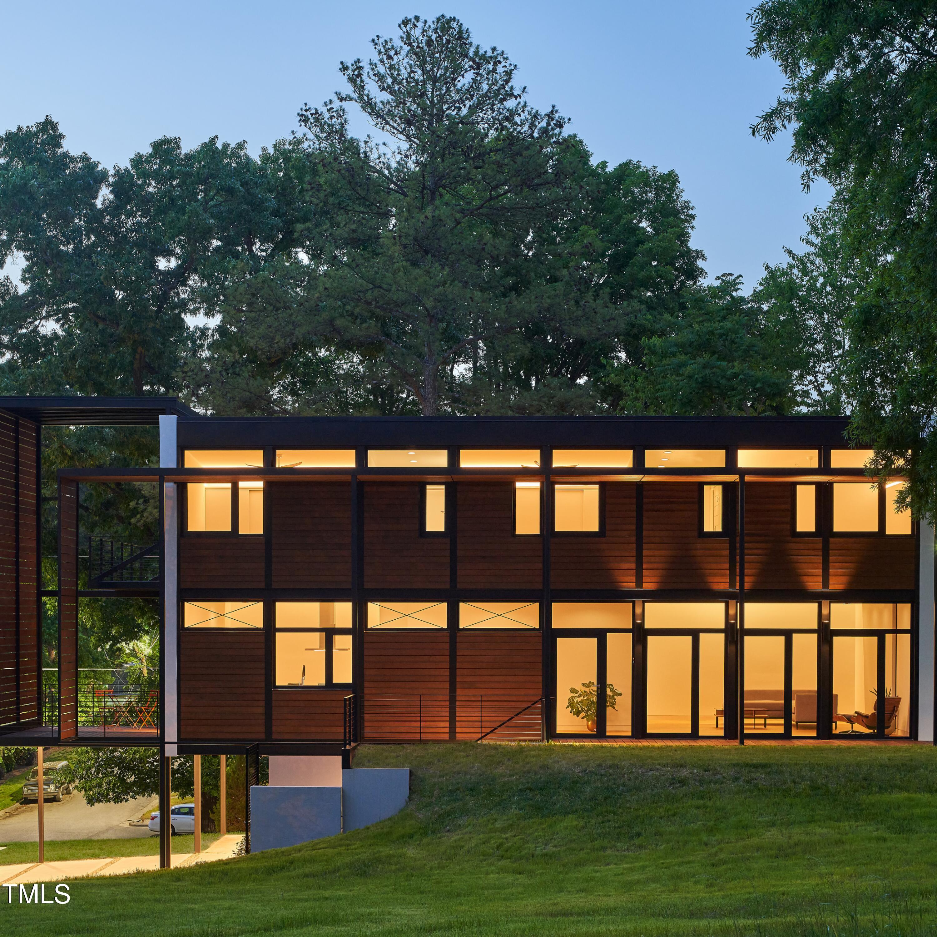 922 Tower Street Raleigh, NC 27607 - Photo 42 of 48 a front view of a house with a yard