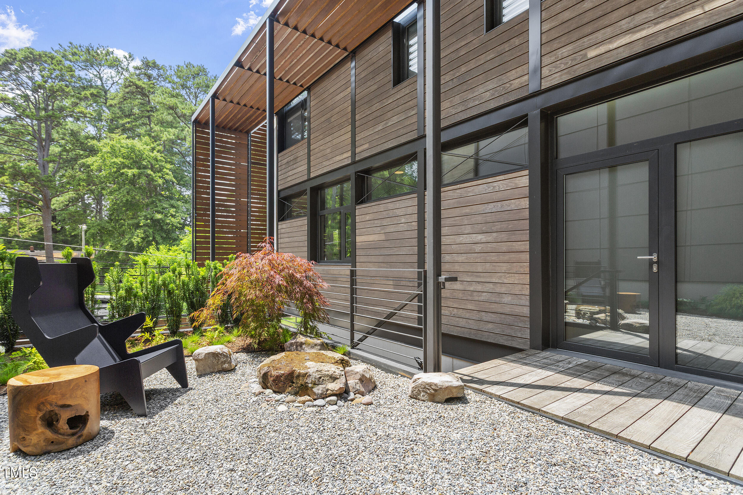 922 Tower Street Raleigh, NC 27607 - Photo 5 of 48 a backyard of a house with outdoor seating