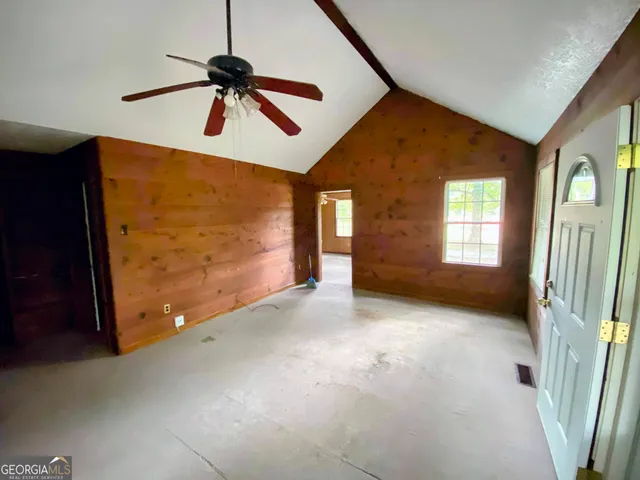 a view of empty room with windows