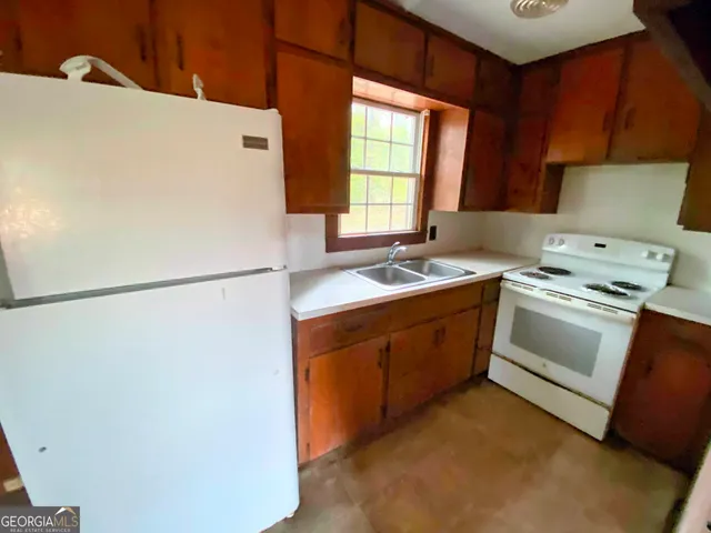 a utility room with washer and dryer