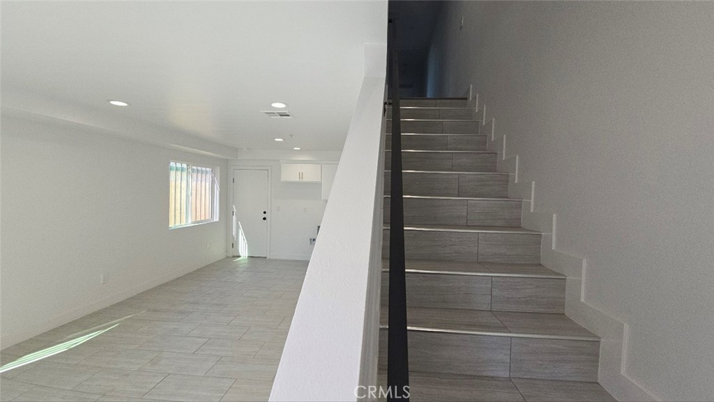 10415 South Avalon Boulevard Los Angeles, CA 90003 - Photo 11 of 40 a view of walk in closet with empty racks