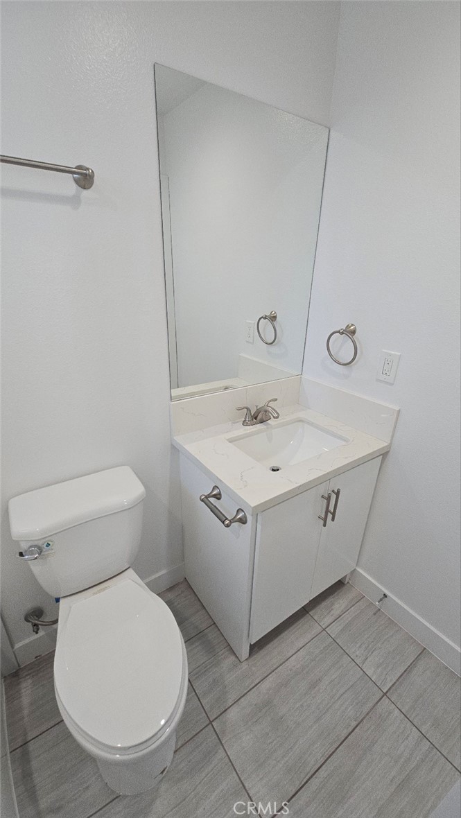 10415 South Avalon Boulevard Los Angeles, CA 90003 - Photo 15 of 40 a utility room with a sink and a toilet