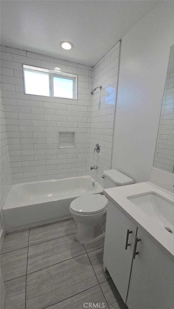 10415 South Avalon Boulevard Los Angeles, CA 90003 - Photo 23 of 40 a bathroom with a sink a toilet and shower